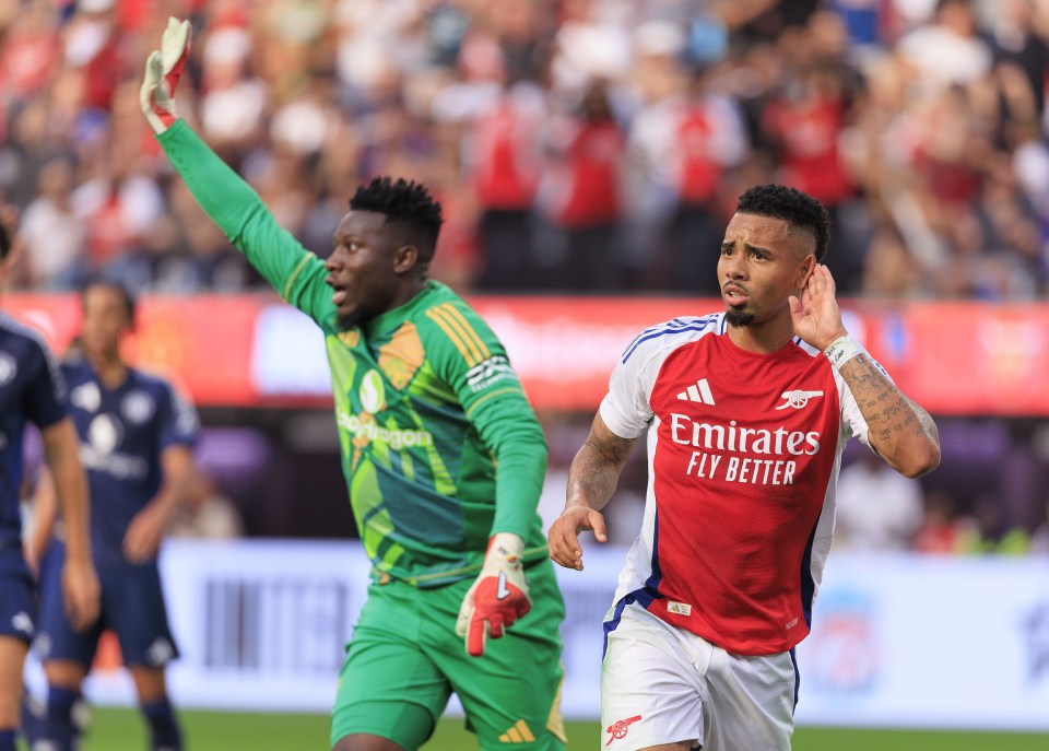 Gabriel Jesus wheels away in celebration after scoring past Andre Onana