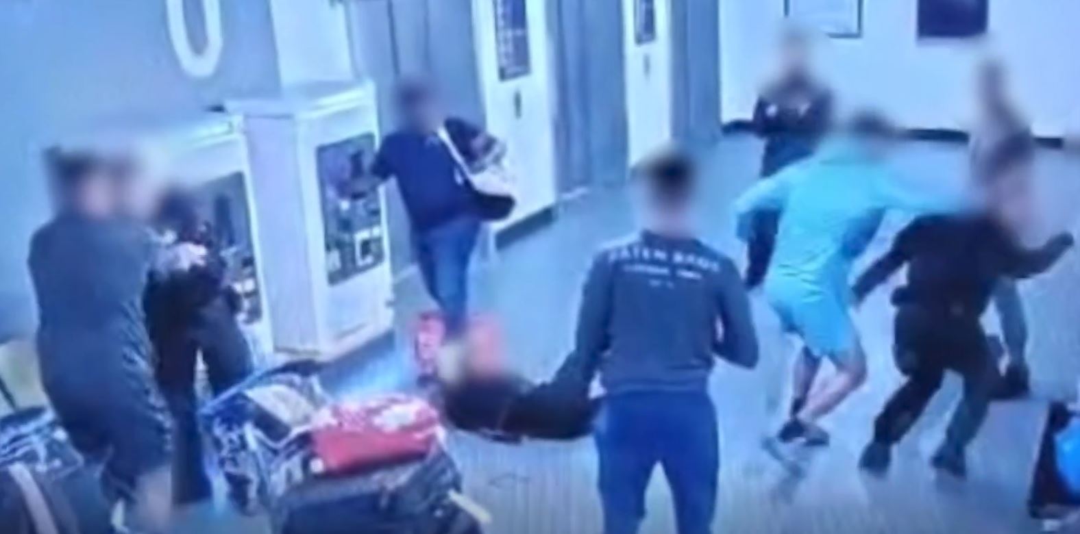 At one point one of the men appears to punch a female police officer (R)