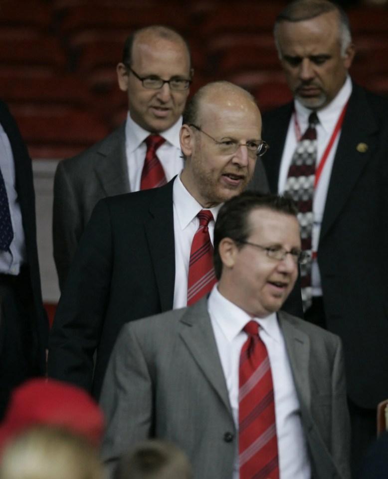 Bryan Glazer standing in front of his brothers Avram and Joel during the Champions League qualifier between Man U and Debreceni on August 9, 2005