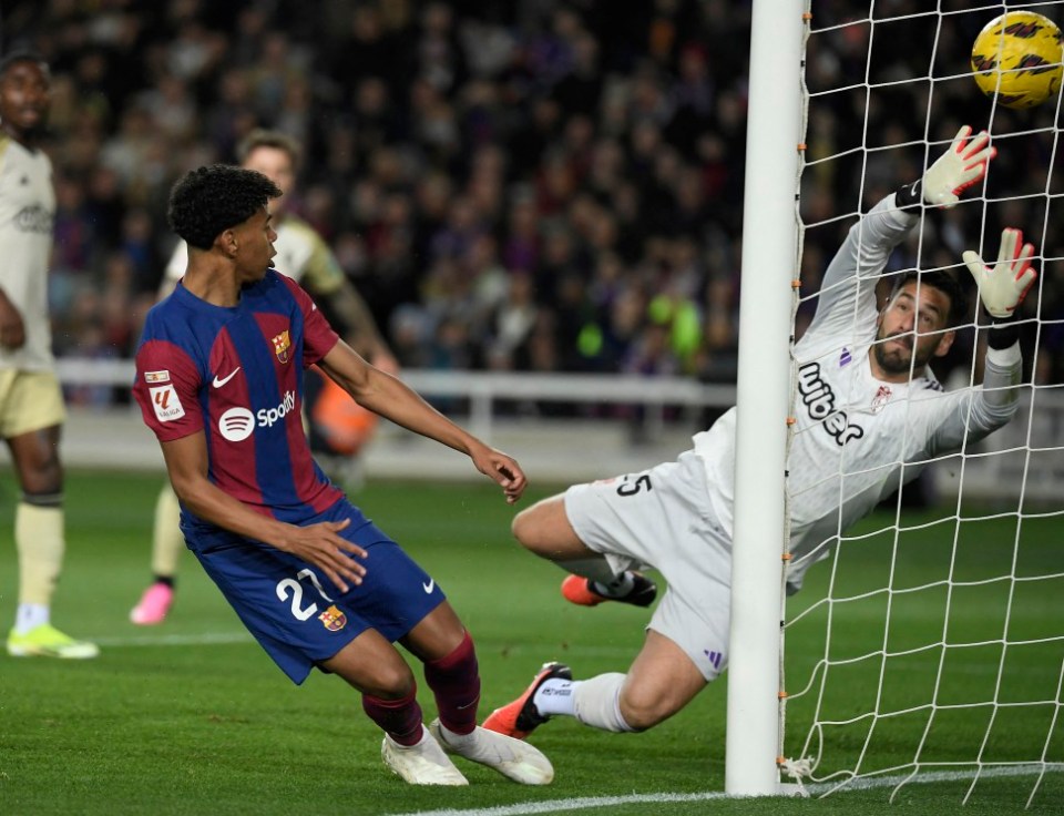 Lamine Yamal scores the opening goal during the match between FC Barcelona and Granada FC in February 2024