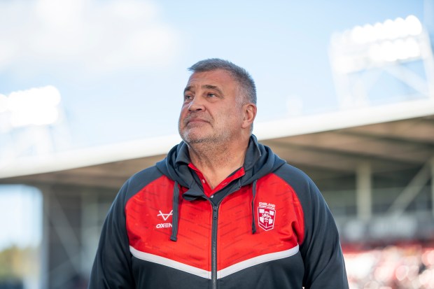 a man wearing a jacket that says england on it