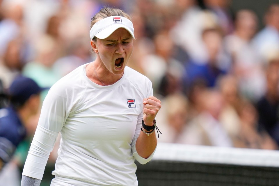 Barbora Krejcikova of the Czech Republic reacts after winning a point against Jasmine Paolini of Italy during the women's singles final at the Wimbledon tennis championships in London, Saturday, July 13, 2024. (AP Photo/Kirsty Wigglesworth)