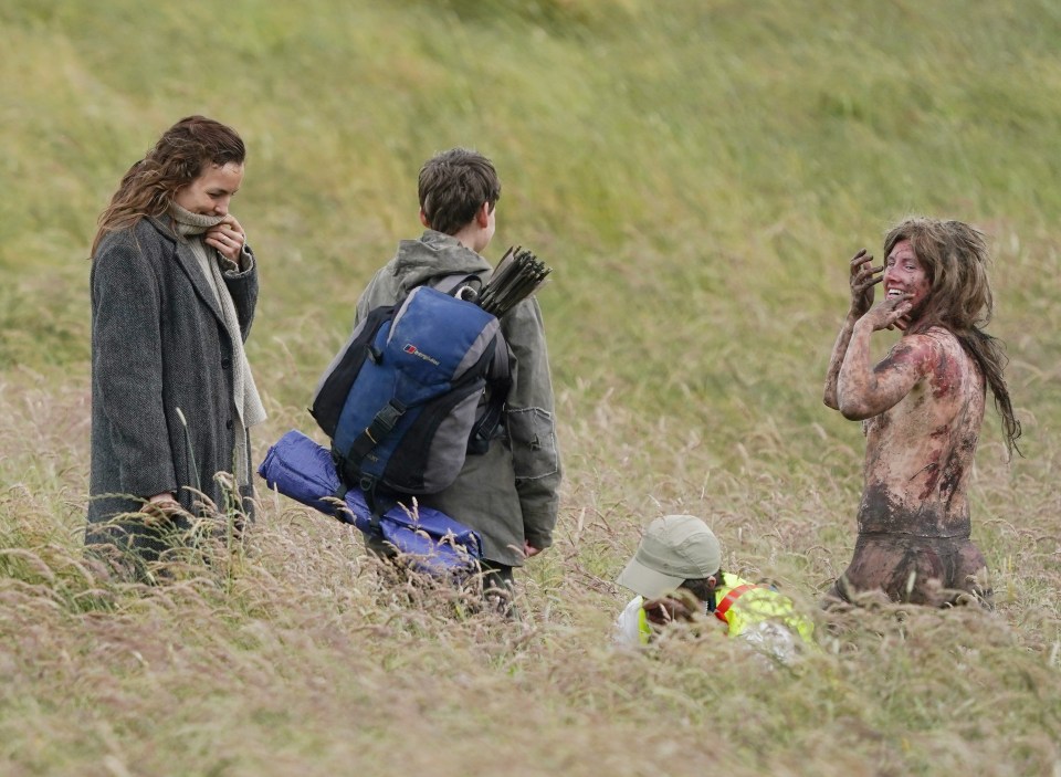 Jodie shares a laugh with a zombie extra and her cast mates