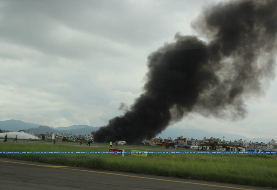 KATHMANDU, NEPAL - JULY 24: (----EDITORIAL USE ONLY MANDATORY CREDIT - 'NEPAL POLICE' / HANDOUT' - NO MARKETING NO ADVERTISING CAMPAIGNS - DISTRIBUTED AS A SERVICE TO CLIENTS, DO NOT OBSCURE LOGO----) A black smoke rises following the aircraft belonging to Saurya Airlines "crashed during takeoff" at the Tribhuvan International Airport (TIA) in the capital Kathmandu, Nepal on July 24, 2024. 18 bodies of passengers and crew have been recovered after the crashed. (Photo by Nepal Police/Anadolu via Getty Images)