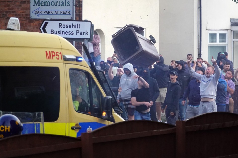 Bins and other objects were hurled at police