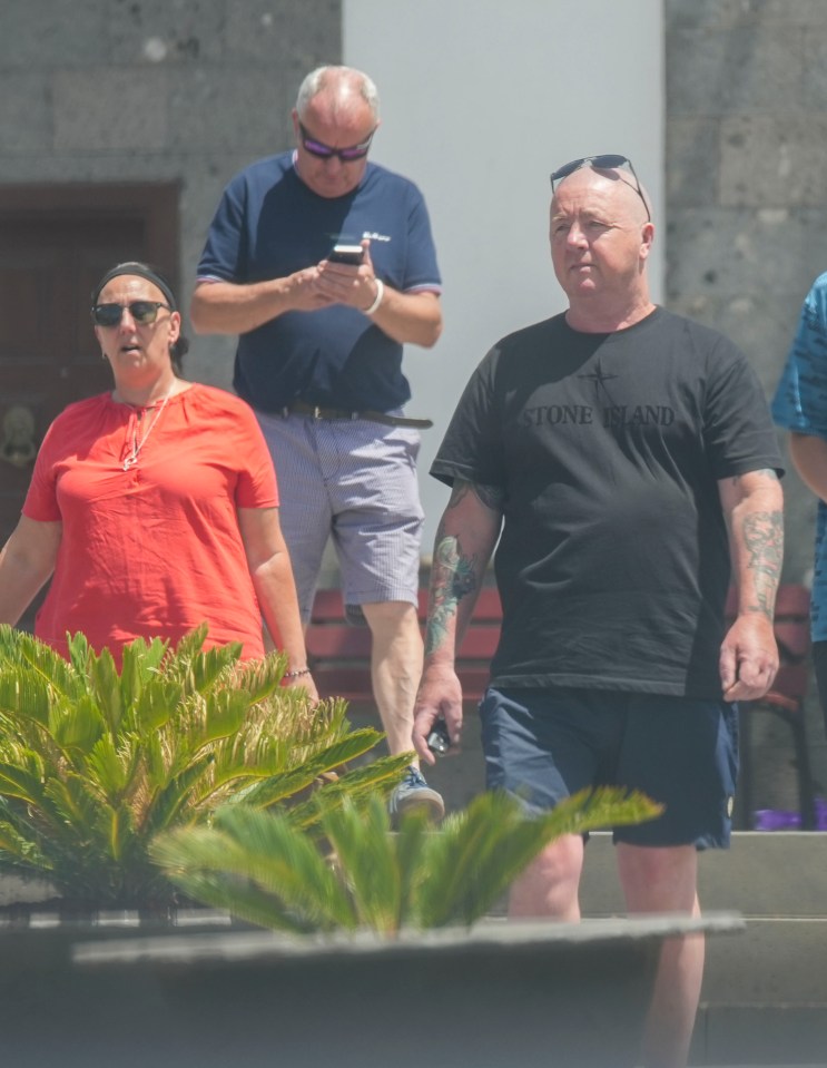 © Ian Whittaker.18/07/2024..Jay Slater, missing teenager, Tenerife. Family and friends visit church in town Santiago del Teide. .Pictured. Dad Warren Slater ( black shirt),Debbie Duncan Mother orange top and with family friends leaving the Tenerife Church. ..Photo credit : Ian Whittaker