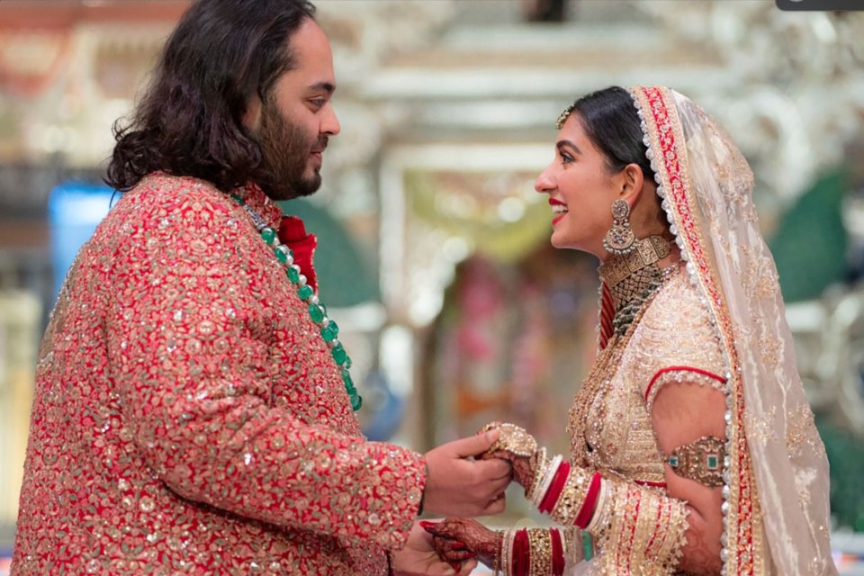 Anant Ambani holds hands with Radhika Merchant during their wedding ceremony