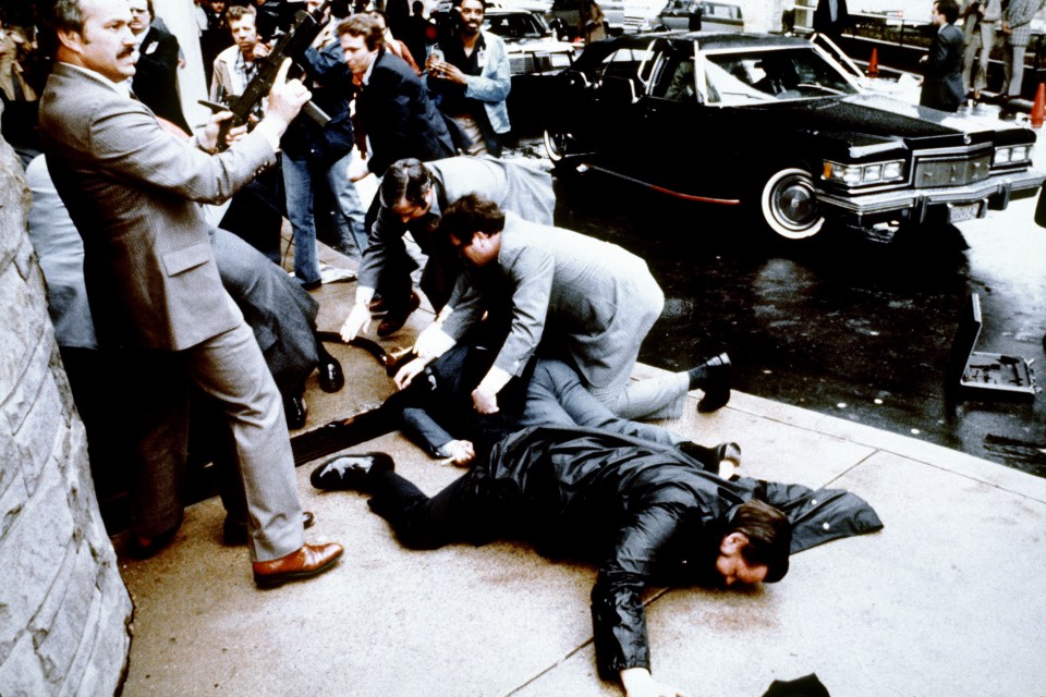 Police and Secret Service agents react during the assassination attempt on March 30, 1981