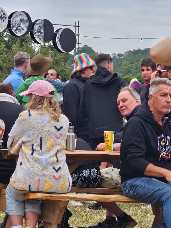 Lewis Capaldi, in the rainbow hat, was spotted back at Worthy Farm with a group of pals