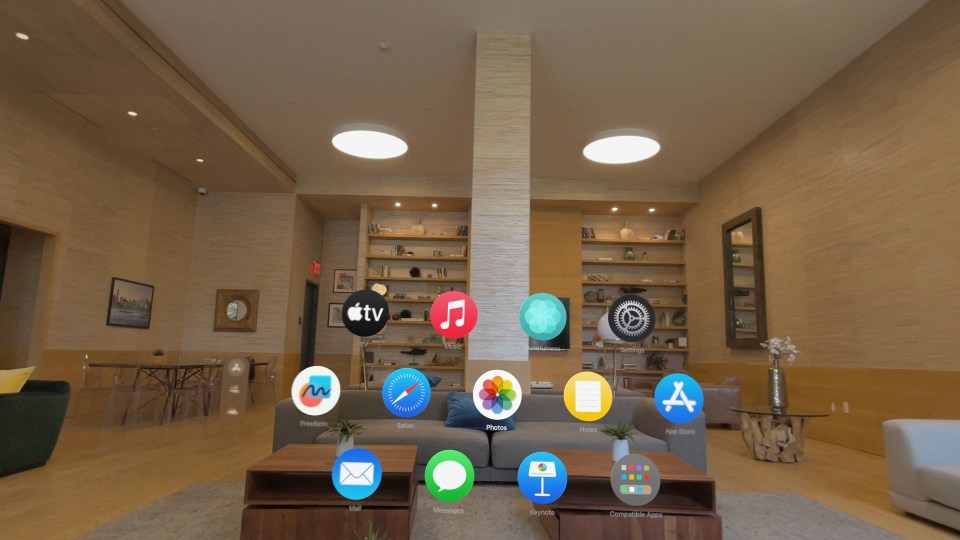 The apps icons are overlaid on top of a view of the real room