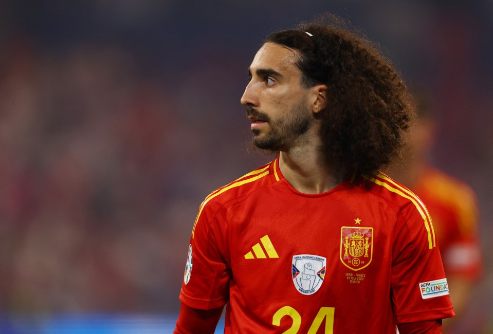 a man with curly hair wears a red adidas jersey