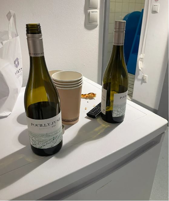 two bottles of pouilly-fume wine sit on a counter