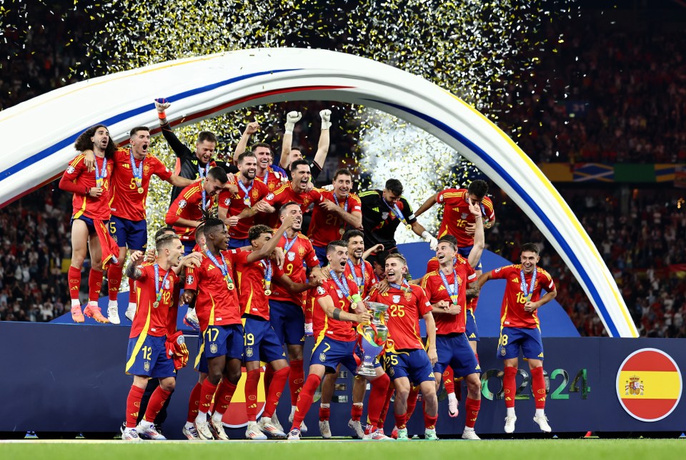 a group of soccer players are celebrating on the field