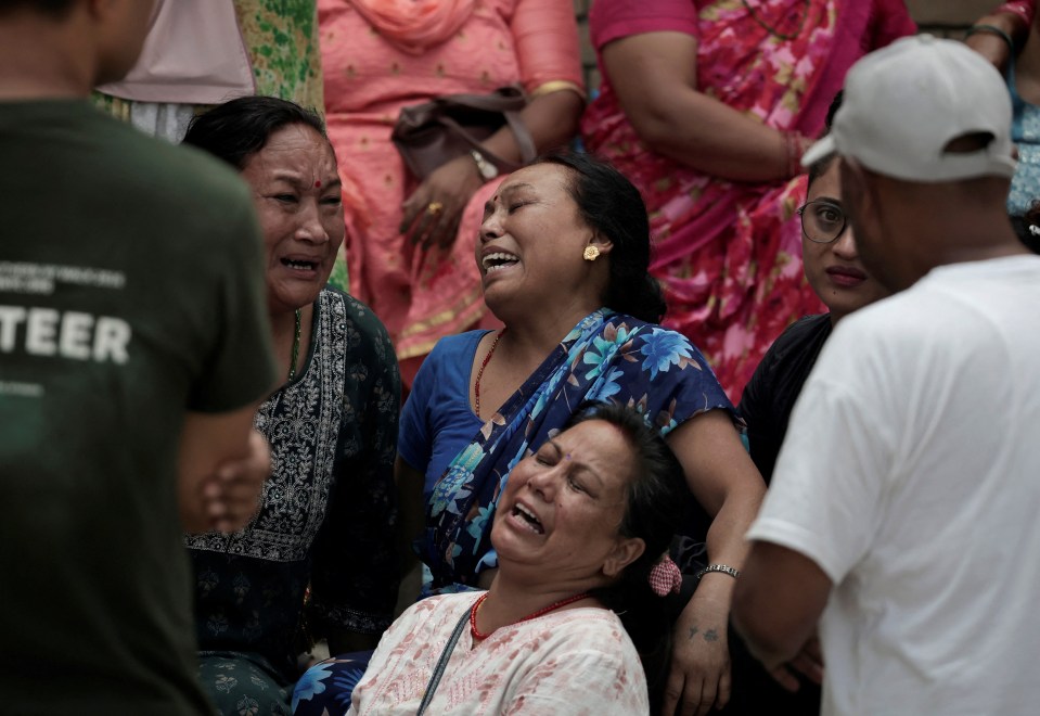 Distraught family members gathered outside the hospital the bodies were taken to be examined