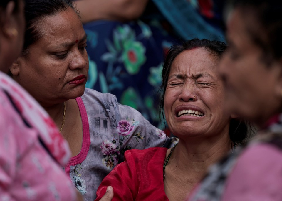 The family gathering outside the hospital was a scene of devastation