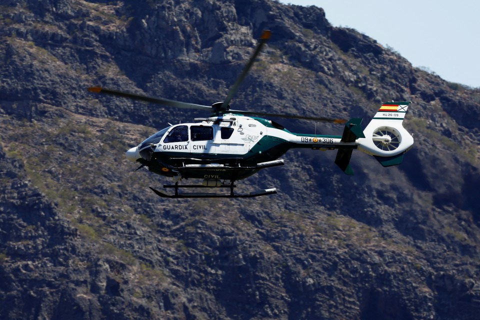 A Guardia Civil helicopter searches for the young Briton Jay Slater in the Masca ravine, on the island of Tenerife, Spain, June 29, 2024. REUTERS/Borja Suarez