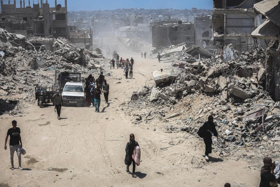 Mandatory Credit: Photo by Saher Alghorra/ZUMA Press Wire/REX/Shutterstock (14612751x) Residents of the city of Khan Yunis return to their destroyed homes east of Khan Yunis after the Israeli army withdrew from it and announced the end of the military operation there. July 30, 2024, Gaza, Khan Yunis, Palestinian Territories:.Residents of the city of Khan Yunis return to their destroyed homes east of Khan Yunis after the Israeli army withdrew from it and announced the end of the military operation there., Palestine - 30