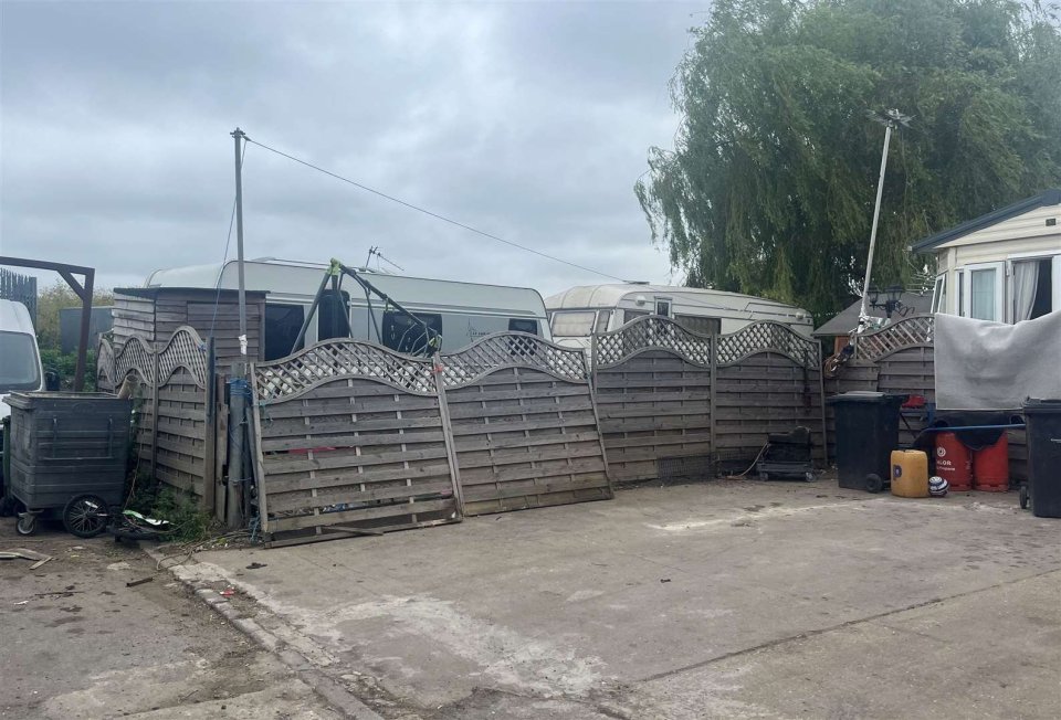 The state of the council run caravan site in Gravesham, Kent. Photo released July 8 2024. A "forgotten" caravan site that has been plagued with rats, litter, and sewage smells may force residents to abandon their culture. The Council run caravan site in Gravesham, Kent,-- which is home to eight Roma and families-- has been abandoned by the Council and Royal Mail workers after reports of "anti-social behaviour" towards staff. Each plot on the run-down land consists of a static home, a shed for bathing facilities and space to keep trailers and caravans.One resident, Priscilla, has been living in Denton since she was 16, back when the site was first built nearly 50 years ago..