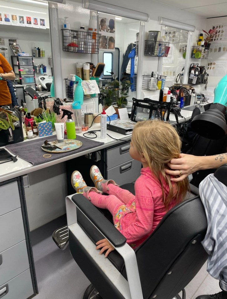 Avy sits in hair and makeup whilst on set for one of the productions she has filmed