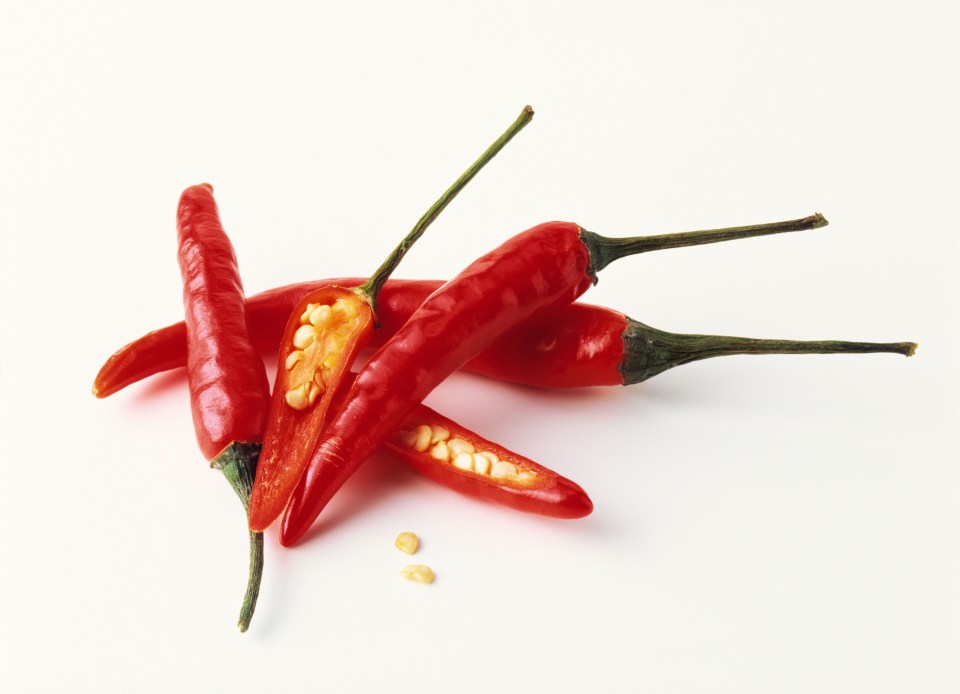 The capsaicin in hot chilli peppers causes you to sweat more easily — releasing body heat