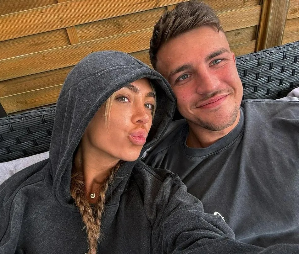 The pair shared a cosy snap to Instagram cuddled up on the couch