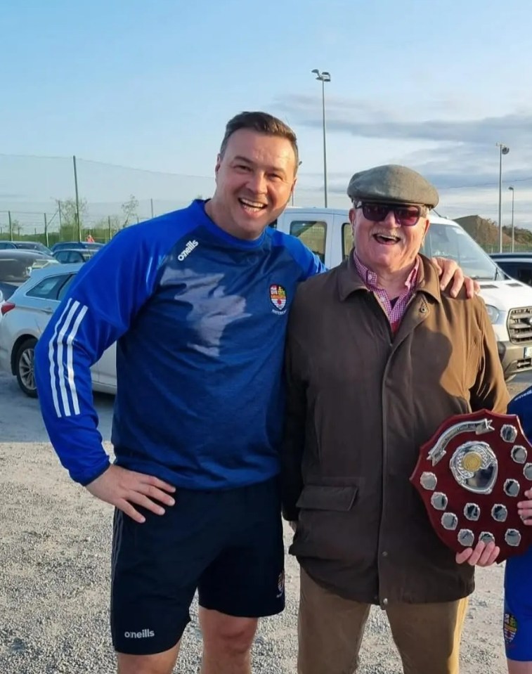 two men and a boy holding a plaque that says ' o'neill ' on it