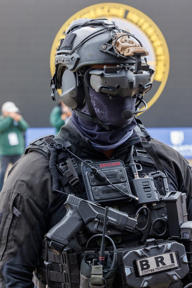 The BRI are armed with sniper rifles, Kevlar helmets, body armour, glock pistol, riot shields and assault rifles.