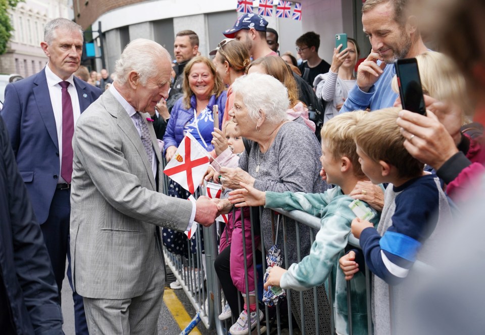 King Charles meets wellwishers during a visit to Royal Square for a Special Sitting of the States Assembly and Sitting of the Royal Court in St Helier