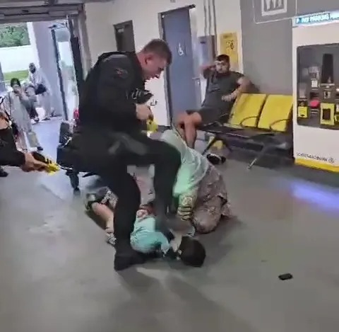 The officer appears to stamp on the man's head after kicking him in the face