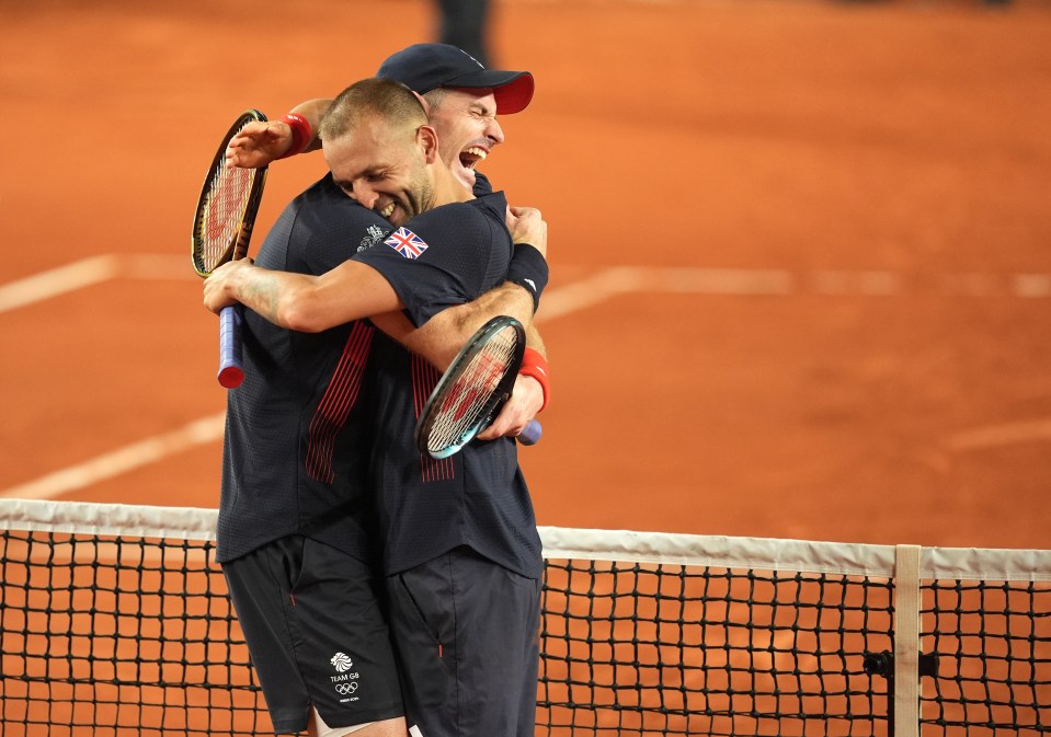 Andy Murray and Dan Evans celebrate after winning the Men’s Doubles Second Round