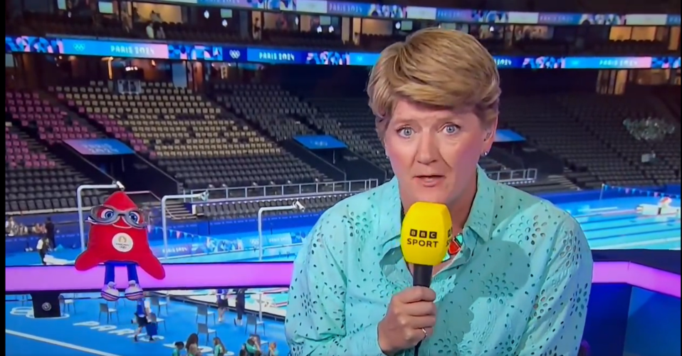 a woman holding a microphone that says bbc sport