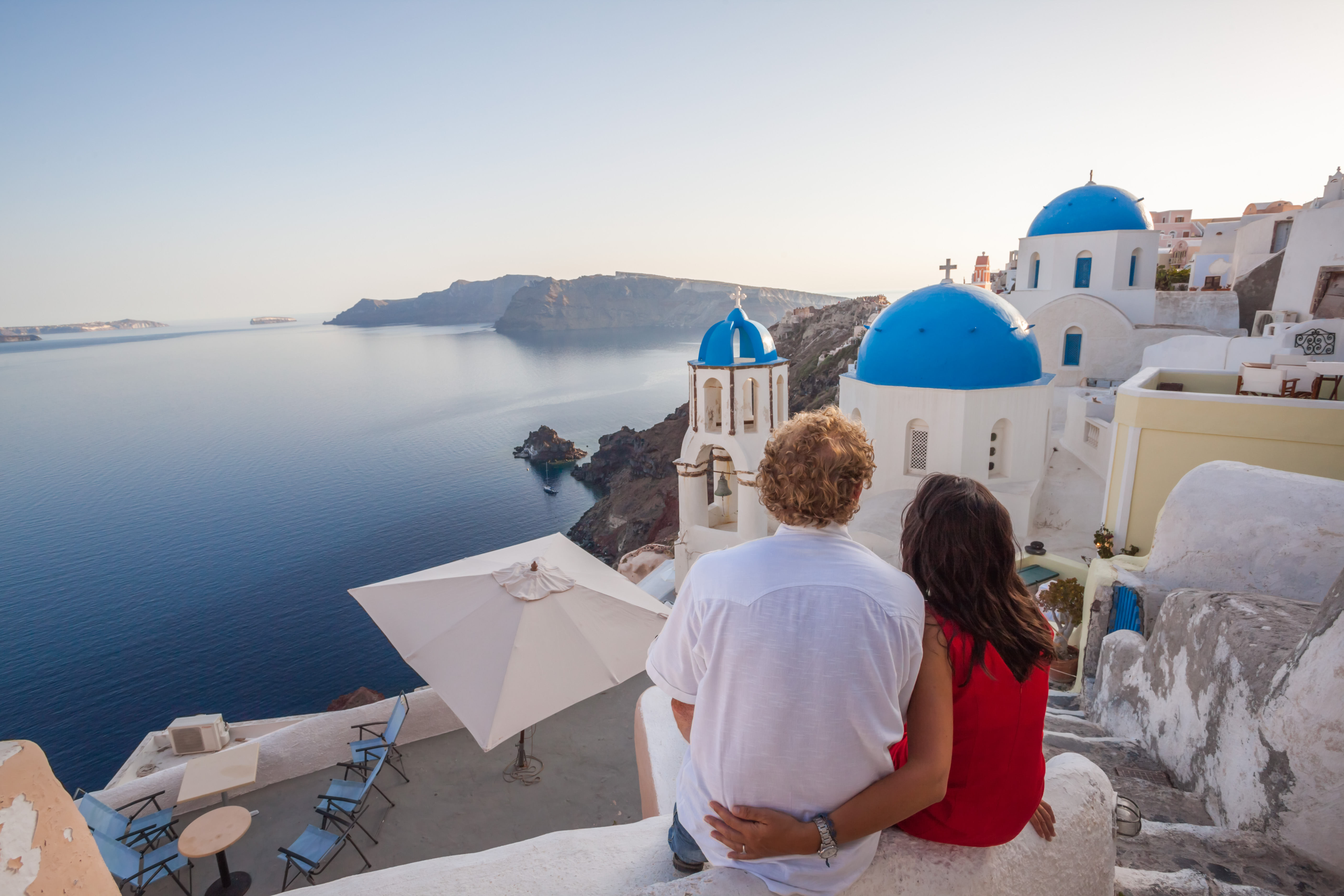 Tourists flock to Santorini in Greece to see its whitewashed walls