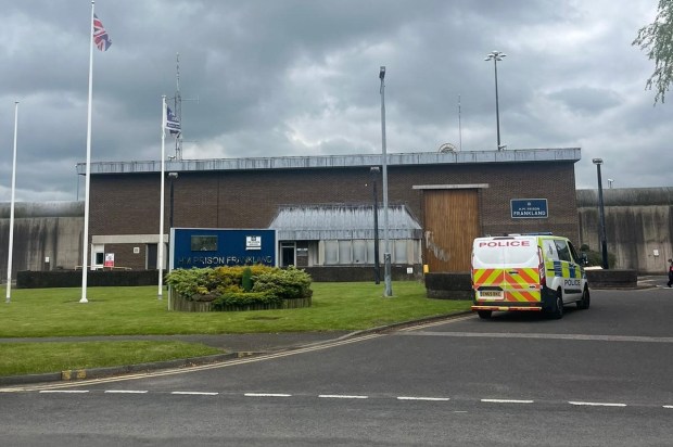 a police van is parked in front of a building that says frankland