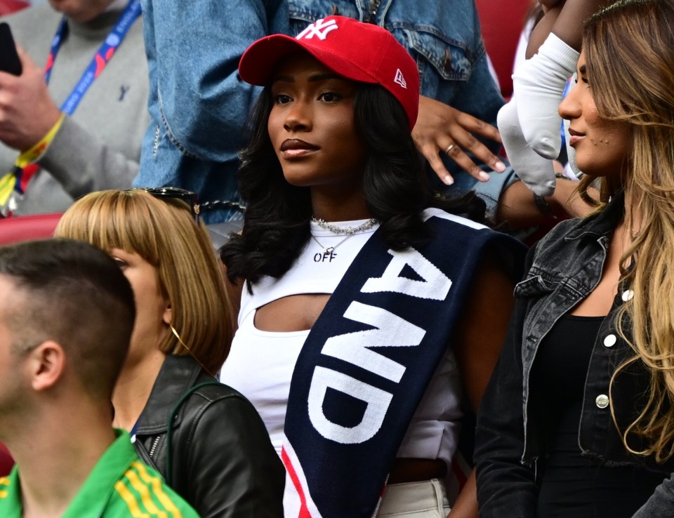 Saka's girlfriend Tolami Benson had an England scarf on for the game