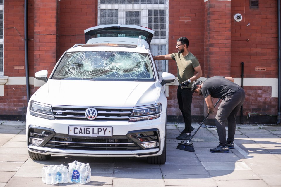 A damaged car inside the car park of the Southport Islamic Society Mosque