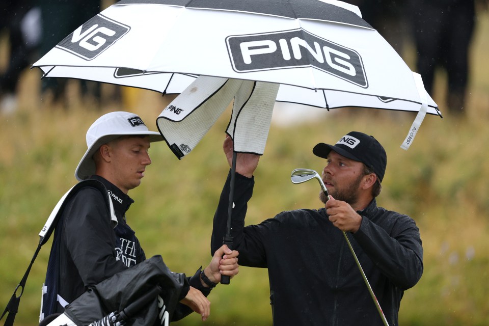 Brown had to dry clubs with a towel amid dodgy weather