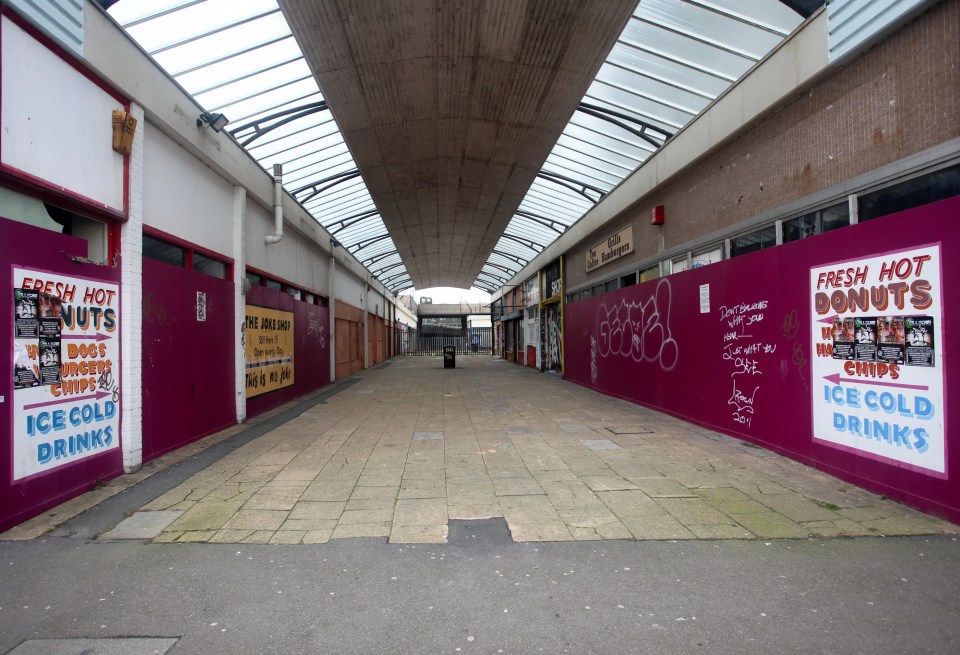 All the shops in Arlington Arcade are now boarded up and the area is deserted