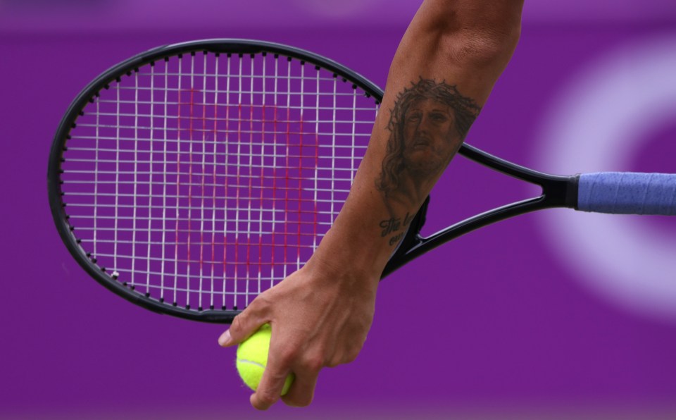 A detailed view of the tattoo of Jesus on Daniel Evans' arm