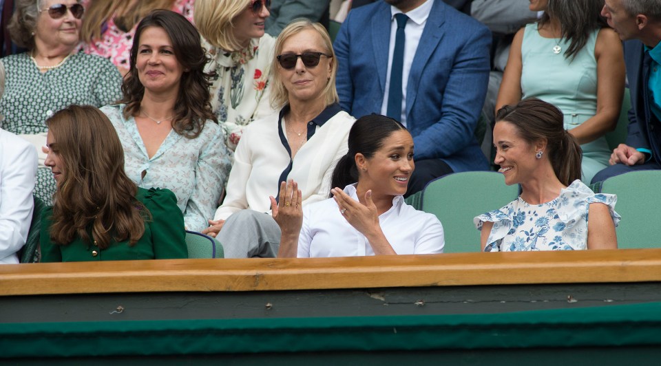 Meghan sat in the middle of Kate and sister Pippa Middleton