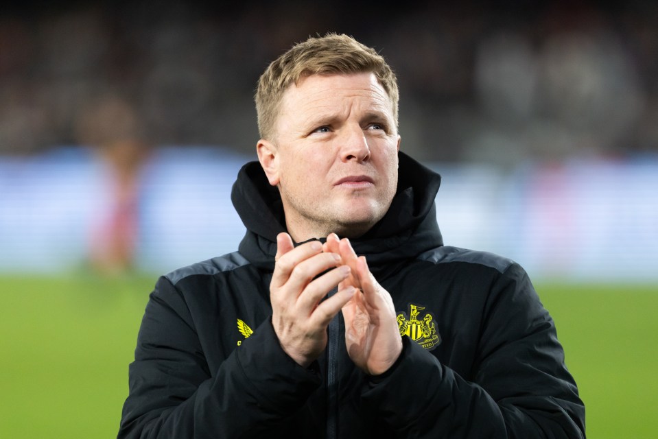 a man wearing a black jacket with the word united on it