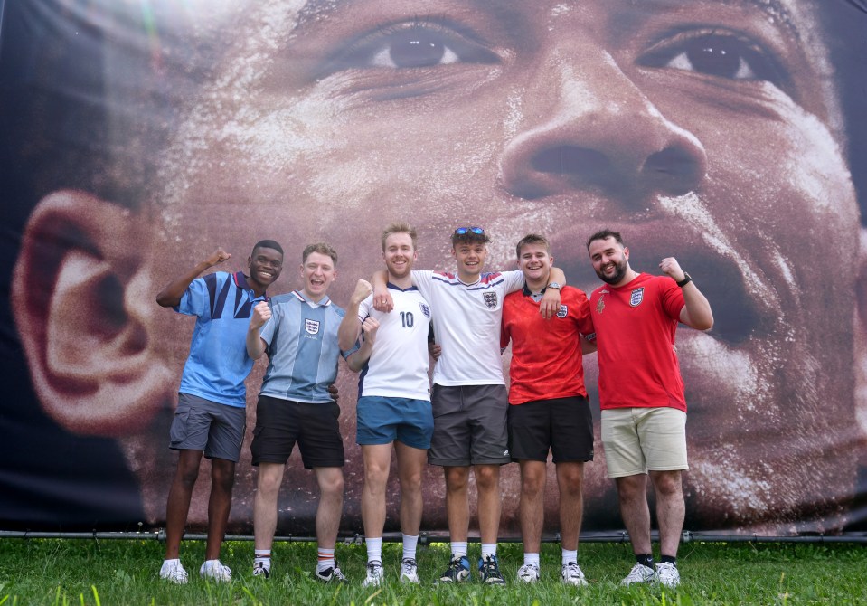 England fans stand in front of an image of Jude Bellingham in Berlin, Germany