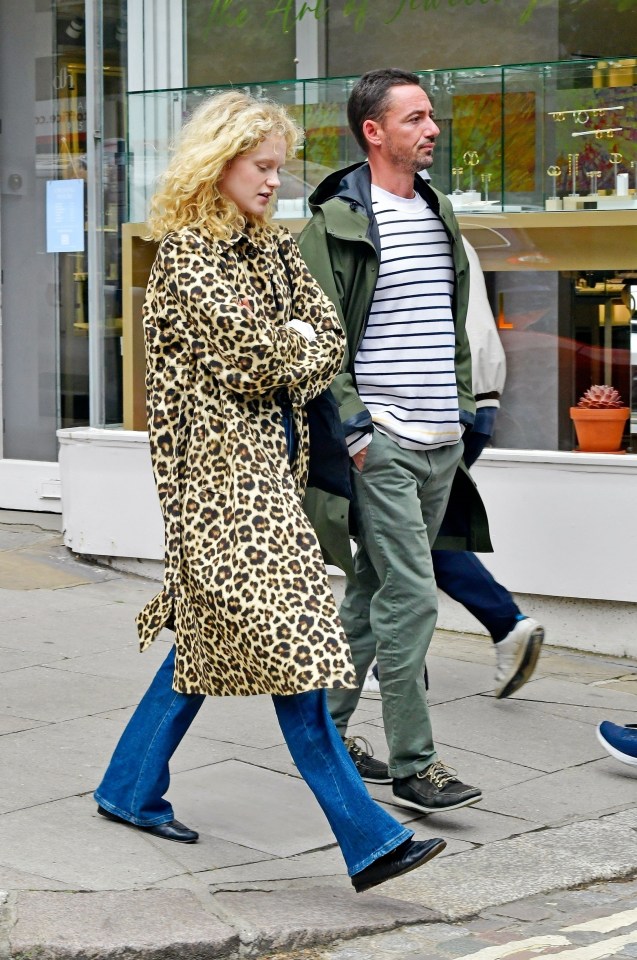 Emma Laird has found someone to make her smile again as she enjoys a stroll in North London with Gorillaz keyboardist Jesse Hackett