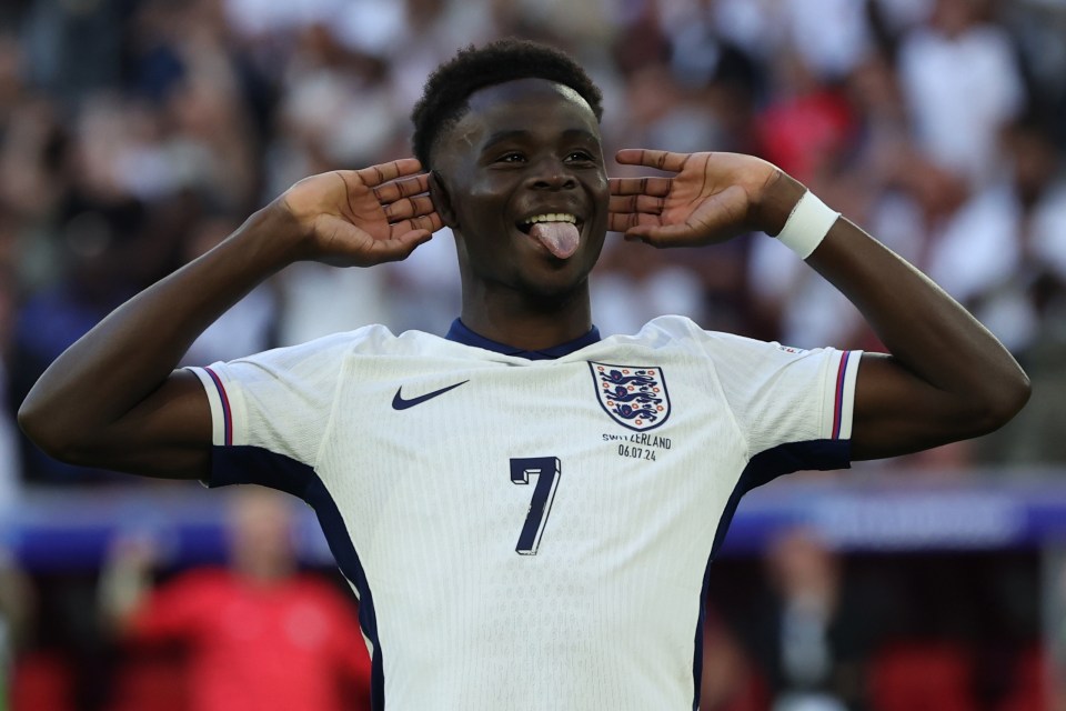 Bukayo Saka scores his penalty and celebrates