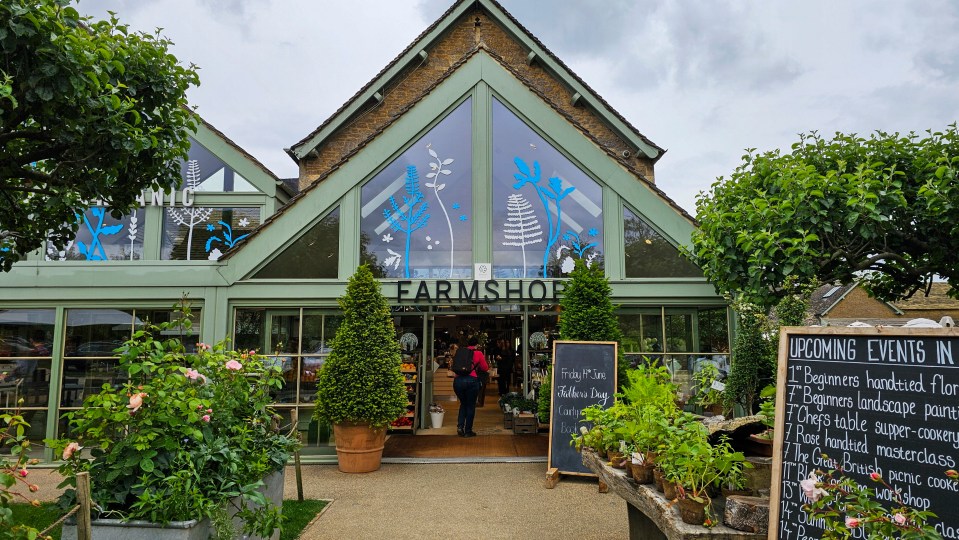 a farm shop with a sign that says upcoming events in