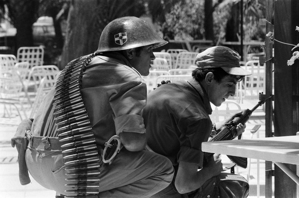 a soldier with a helmet with a cross on it