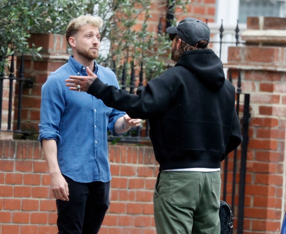 The I'm A Celebrity winner, 31, could be seen exchanging words with his best pal in West London