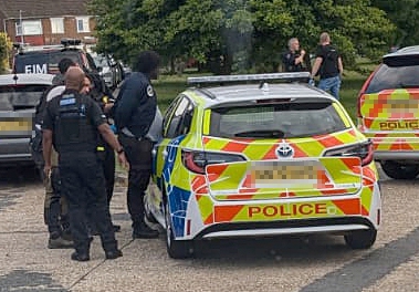 Officers arresting a man in Mooring Road, Rochester