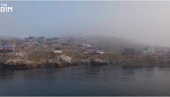 an aerial view of a small town on a foggy day