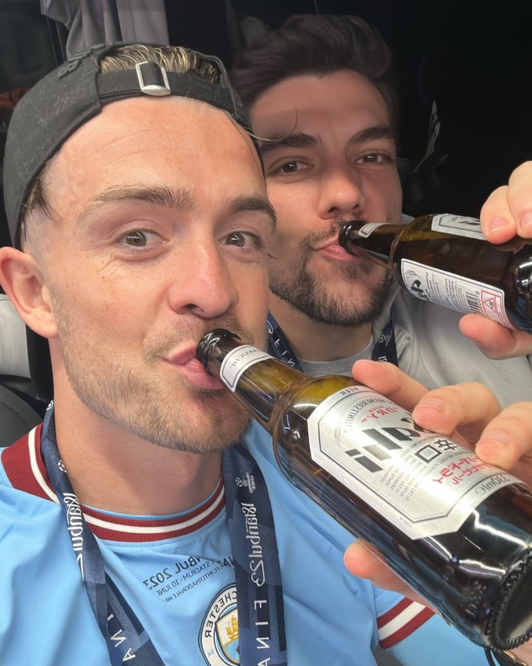 Jack toasts Man City's treble with the team's goalkeeper Stefan Ortega