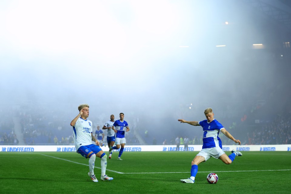 soccer players on a field with a banner that says i united